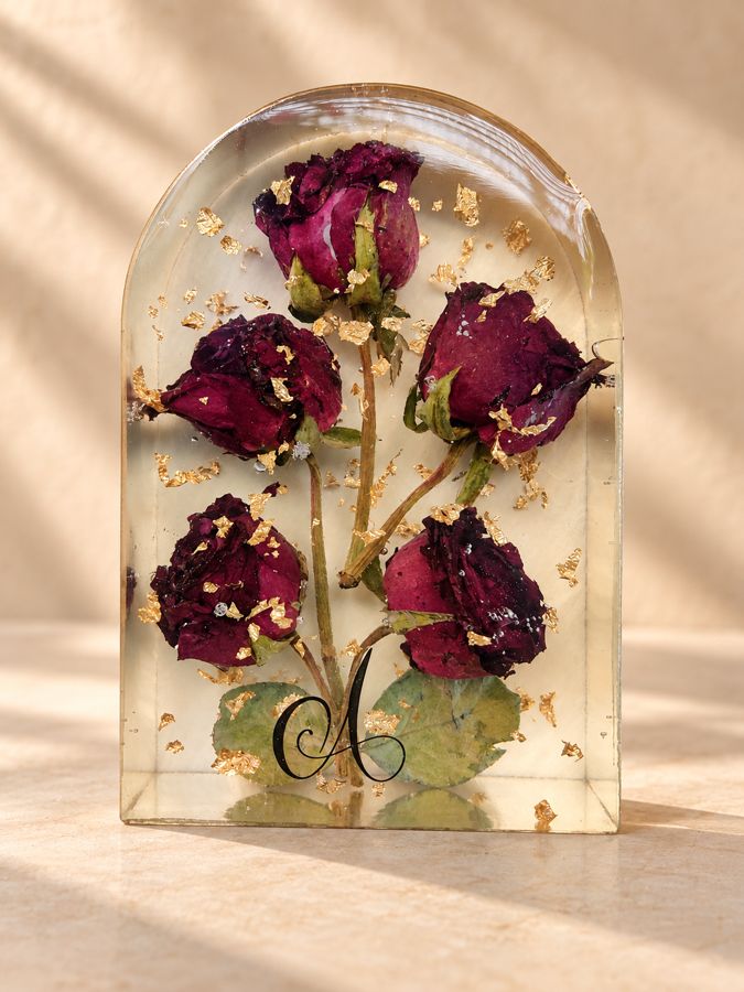Preserved roses set in a handmade resin dome by Singh's Resin Art