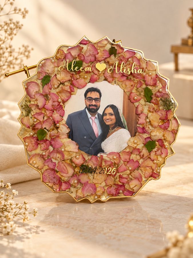 Wedding flower preservation resin frame with preserved flowers and a couple's photograph